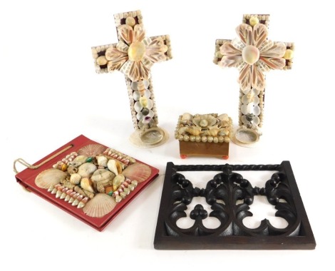 A pair of shell art crucifixes, a blotter with indistinct inscription, a carved oak panel, etc.