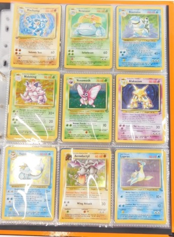 A collection of original Pokemon cards, various types to include trainer cards.