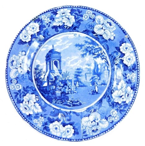 An early 19thC blue and white transfer printed plate, with floral border, decorated with figures in a scene, unmarked, 27cm diameter.