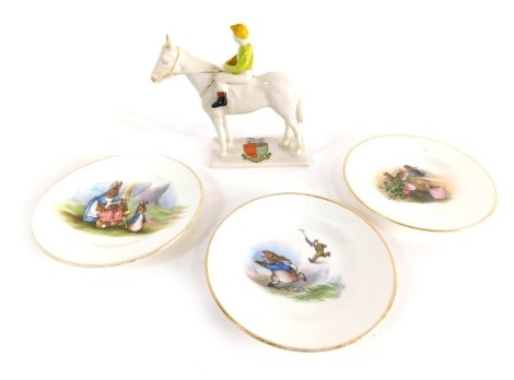 A Carlton crested china Newmarket racehorse, in yellow and green colour way, 12cm high, and three Grimwade Beatrix Potter Peter Rabbit child's plates. (4)