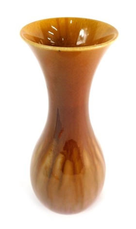 A Linthorpe pottery vase, with inverted stem and bulbous body, marked HC 124, in purple and brown running glazes, impressed marks beneath, probably by Henry Chapman, 27cm high.