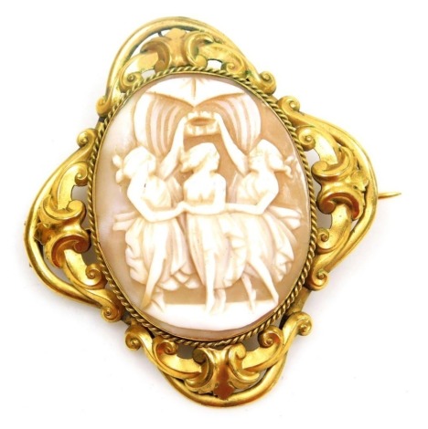 A late 19thC shell cameo brooch, decorated with the Three Graces, in a foiled yellow metal surround, 5.5cm wide.