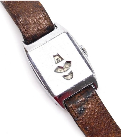 A mid century gentleman's Jump Hour stainless steel cased wristwatch, with three apertures, each for the hour, minutes and seconds, number 0534833, on a brown leather strap.