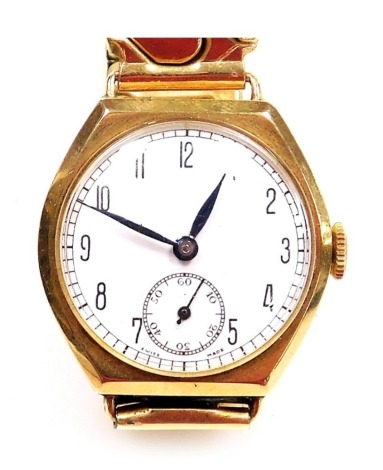 A gentleman's 9ct gold cased wristwatch, circular white enamel dial bearing Arabic numerals, subsidiary seconds dial, fifteen jewelled movement, in an oblong case, back engraved Presented to 'Mr E J Sharpe, by the Night Shift Boultham Works 1941', on a pl