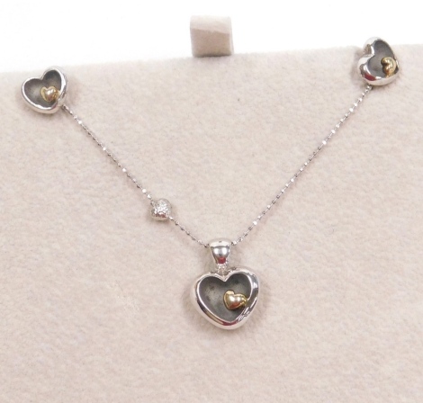 A Blossom of Copenhagen silver heart shaped pendant necklace, and pair of matching ear studs, boxed.