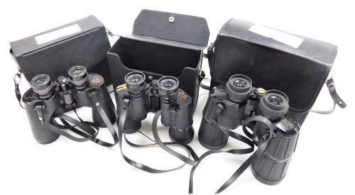 A pair of Swift Saratoga 8x40 binoculars, model no. 801, pair of Swift Tecnar 8x40 binoculars, no. 7323, and a pair of Wilkinson of Dartmouth 10x50 wide angle field binoculars, all cased. (3)