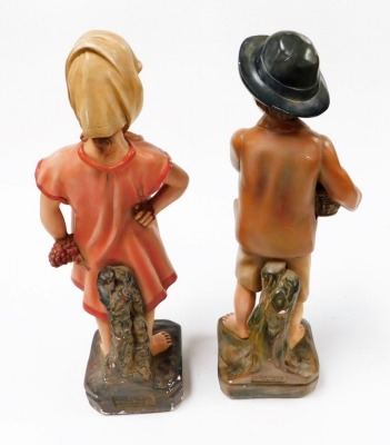 A pair of 1930's chalkware figures, a young girl and boy, each 47cm high. - 2