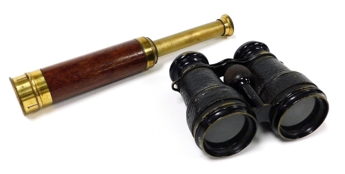 An early 20thC brass and wooden bound three draw telescope, together with a pair of leather bound field glasses. (2)