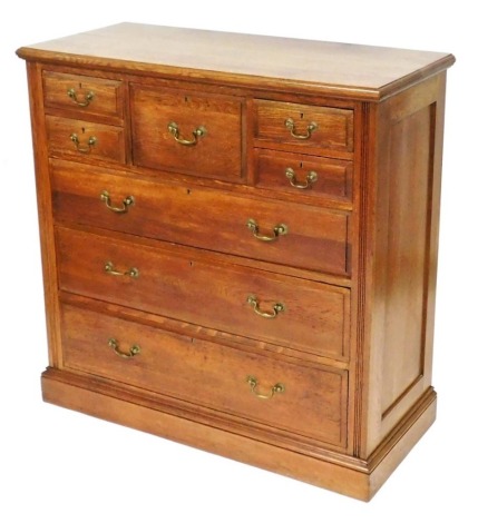 A Victorian oak chest of one deep and four short drawers, over three long graduated drawers, raised on a plinth base, 122cm high, 121cm wide, 53cm deep,