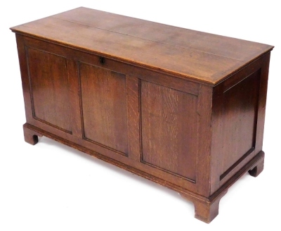 A 19thC oak blanket chest, with a triple panelled front, raised on bracket feet, 73cm high, 132cm wide, 56cm deep.