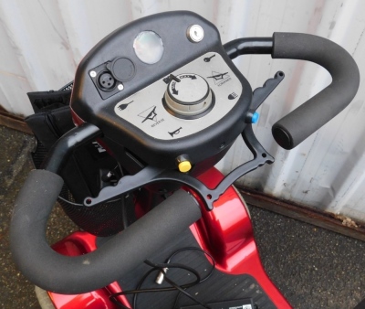 A Sterling Sapphire 2 mobility scooter, in red trim, with charger and cables. - 2