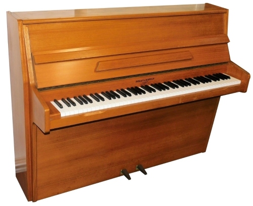 A Barratt and Robinson teak upright piano, overstrung, 140cm wide.