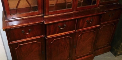 A 20thC mahogany breakfront display cabinet, the top with a moulded dental cornice, above four astragal glazed doors enclosing an arrangement of shelves, the base with four drawers and four cabinets, on a plinth base, 197cm high, 164cm wide, 55cm deep. - 3