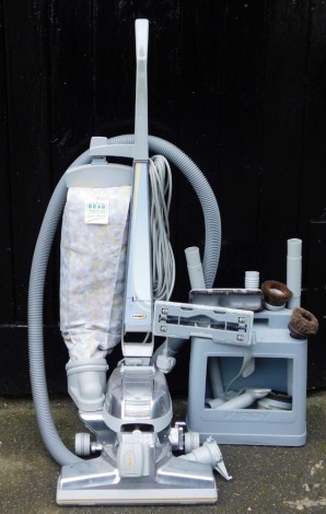 A Kirby Ultimate G Series vacuum cleaner, with accessories.