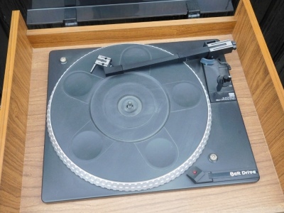 An Amstrad music system, with turntable, stereo tuner, double cassette deck, stereo amplifier, in case, 86cm high, 43cm wide, 38cm deep, together with a pair of speakers. - 2