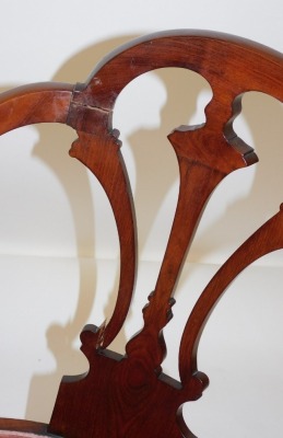 A pair of Edwardian mahogany armchairs, each with carved splats, oval red draylon seats, raised on cabriole legs. - 2