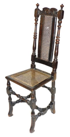 A late 17thC oak and walnut high back chair, with a scroll carved crest rail, cane back, flanked by turned uprights, cane seat, raised on turned legs united by two upper turned stretchers and an H framed stretcher below, 120cm high.