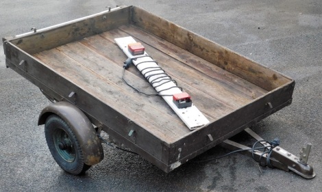 A car trailer, 115cm wide, with light board.