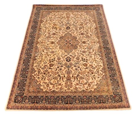 A Belgian Osta Brilliant Birose rug, faun ground rug decorated with floral motifs, within repeating floral borders, 170cm x 240cm.