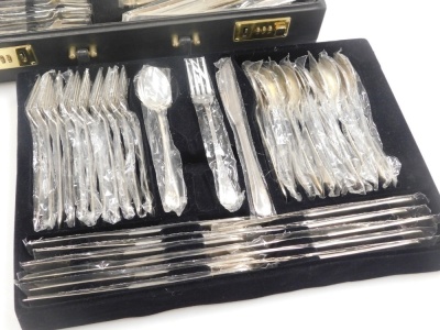 A canteen of cutlery for twelve place settings, of plain design, stamped 830, 98.26oz all in including weight of the plastic sealed bags, contained in a combination suitcase. Purchased in Cyprus by the vendor. - 2