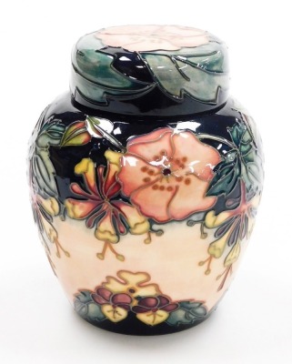 A Moorcroft pottery Oberon pattern ginger jar and cover, impressed marks and signed to underside, 16cm high. - 2