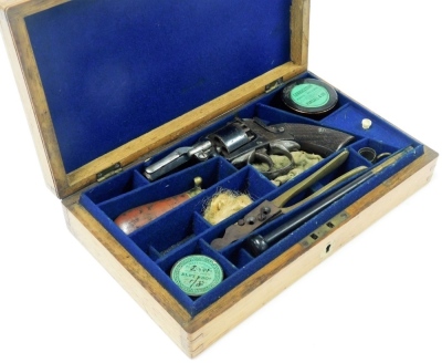 A Victorian double action percussion revolver, patent number 38162, together with a bullet mould, shot flask and other shooting apparel, in an oak case.