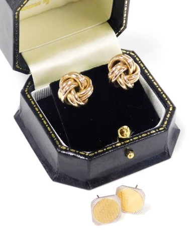 A pair of rose coloured knot earrings, yellow metal, 4.5g, together with a pair of bicolour earrings with engine turned decoration, stamped plat and 18ct, 3.1g.