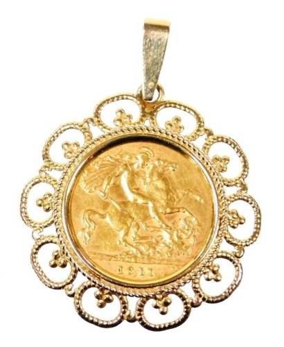 A George V gold half sovereign 1911, in a 9ct gold pendant mount, 5.8g all in.