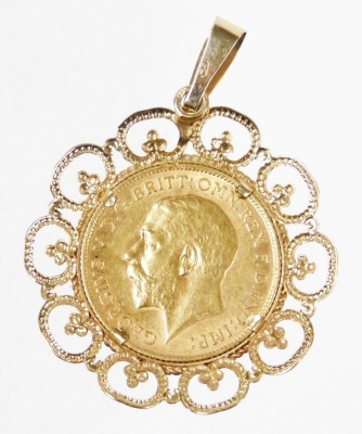 A George V gold half sovereign 1911, in a 9ct gold pendant mount, 5.8g all in. - 2