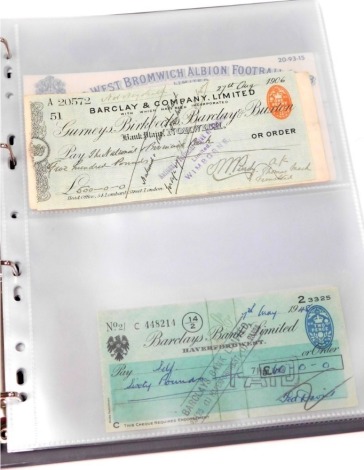 An album of English, Scottish and Irish cheques, including Gurneys, Barclays, and Midland branches, Birmingham and West Bromwich Albion Football Club, Clydesdale and Royal Bank of Scotland, Union Bank of Scotland, and The Bank of Ireland.