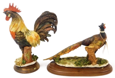 Two Capodimonte figures, one of a cockerel, raised on a wooden base, the other of a pheasant raised on a wooden base, monogrammed GA. - 2