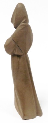 A Lladro matt brown porcelain figure of a monk, modelled in standing pose, printed mark, 33.5cm high. - 2