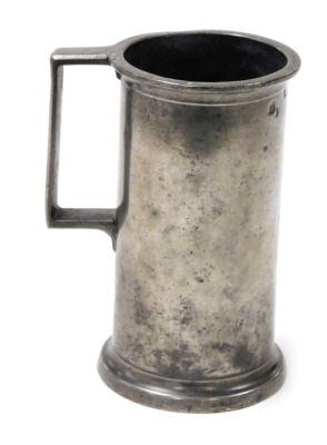 A 19thC pewter tankard, with a protruding rim, bearing various stamps, on a stepped base, stamped to underside Vincent, 18cm high.