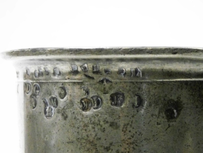 A 19thC pewter tankard, with a protruding rim, bearing various stamps, on a stepped base, stamped to underside Vincent, 18cm high. - 2