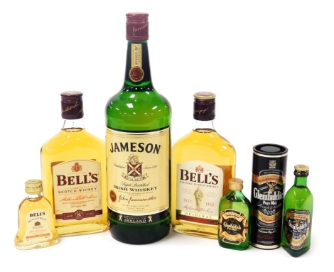 Two 35cl bottles of Bell's Scotch whisky, original and aged eight years, two miniature bottles of Glenfiddich whisky, and another of Bell's Extra Special whisky, and a Jameson bottle of Irish whisky.