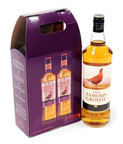 Three bottles of Famous Grouse whisky, two in a presentation box.