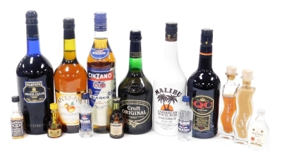 A group of liqueurs and spirits, including sherry, Cinzano, Malibu, Calvados, and assorted miniatures. (a quantity)