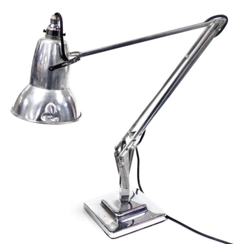 An Anglepoise model 1227 chrome and aluminum desk lamp, designed by Herbert Terry, raised on a stepped square base, (AF). Buyer Note: WARNING! This lot contains untested or unsafe electrical items. It is supplied for scrap or reconditioning only. TRADE ON