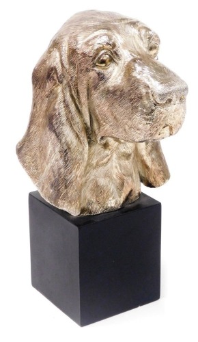 A silver plated bust of a Basset Hound, raised on a square cubed plinth, 34cm high.