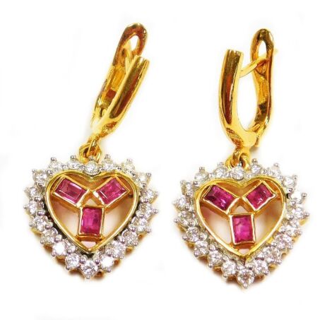 A pair of heart shaped ruby and diamond set drop earrings, complimentary to item 1, three small rectangular rubies surrounded by tiny diamonds in a pierced setting, the whole in precious yellow metal, to locking bar and loop backs, 8.2g all in.