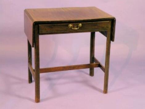 An early 19thC mahogany sofa table with a frieze drawer