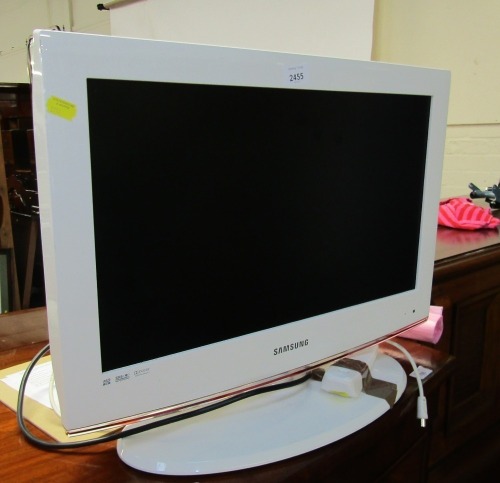 A Samsung flat screen 25" television, in white surround.