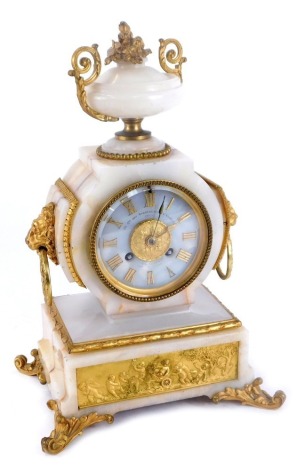 A 19thC French onyx and ormolu mantel clock, inscribed Cie Cle Des Marbres, Onyx D'Algerie Paris 12, for Howell Jones & Co, eight day movement with bell strike, with urn top, on a shaped foot with rococo style panels and lion mask handles, 34cm high, 22cm