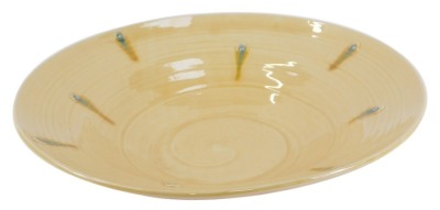 A Fenella Mallalieu studio pottery large serving plate, with turquoise and mustard draped decoration on a yellow ground, 39cm diameter.