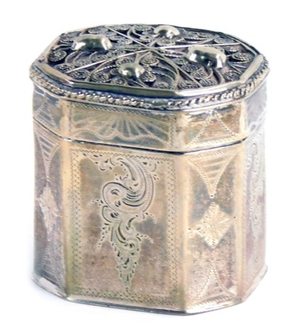 A silver miniature tea canister, with filigree and acorn design top, on octagonal body, with Lion Passant mark, 5cm high, 1oz.