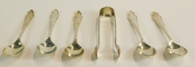 A cased partial set of teaspoons and sugar tongs, each with a shield top, Sheffield 1922, one teaspoon lacking, 2½oz, in fitted case. - 2