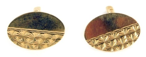 A pair of 9ct gold oval cuff links, with half engraved design, 7.8g.