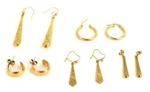 A group of 9ct gold earrings, comprising two pairs of hoops and two pairs of teardrop drop earrings, 8.5g all in.