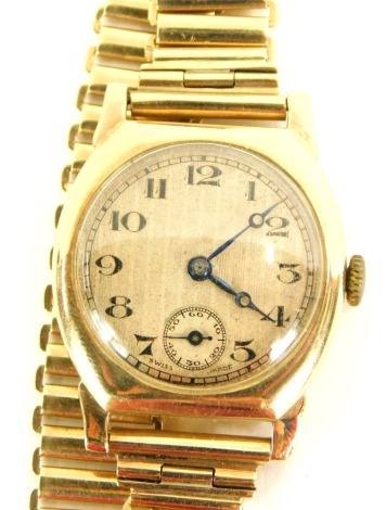 A 9ct gold wristwatch, with a striped cream watch head, with black numeric dial with second dial and blue hands, bearing inscriptions, CH 8-11-43, on a sectional bracelet, stamped 9ct, the watch head 2.5cm wide, 38.7g all.