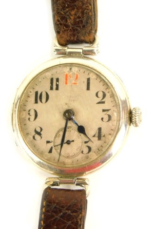 A 1930's silver cased wristwatch, with a silvered coloured dial with painted numeric borders and blue hands, and seconds dial, with rubbed maker, on a brown leather strap, 3cm wide, 31.9g all in.